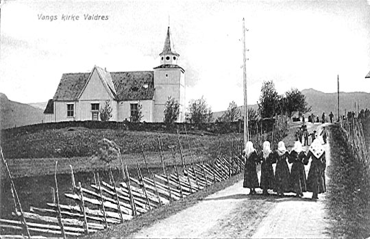 Old photo of Vang Church with young women on road